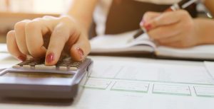 A woman using a calculator