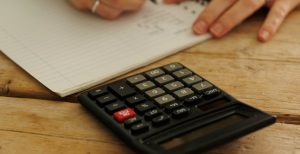 Calculator and pad of paper