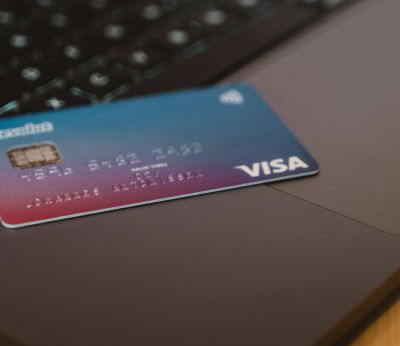 Credit card sitting on top of a laptop