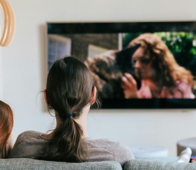 Couple sitting on the sofa watching television