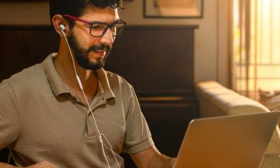 A buy to let landlord on his laptop looking for properties to invest in