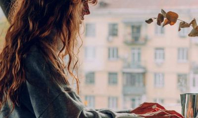 A woman working on her laptop in a cafe